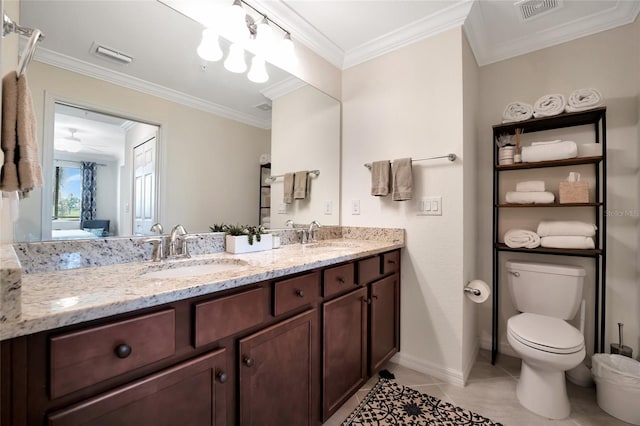 bathroom featuring vanity, tile patterned flooring, ornamental molding, and toilet