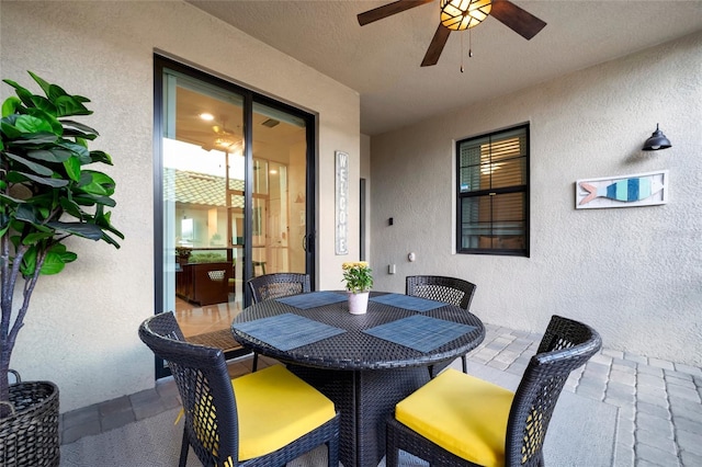 view of patio / terrace featuring ceiling fan