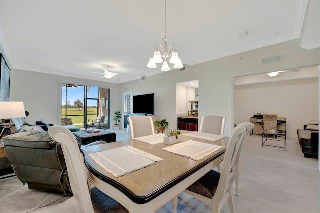 dining room featuring ceiling fan with notable chandelier