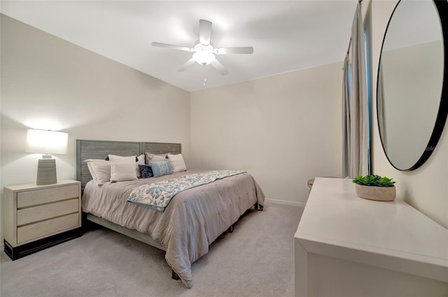 bedroom with ceiling fan and light colored carpet