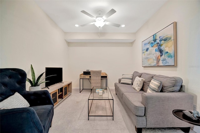 carpeted living room featuring ceiling fan