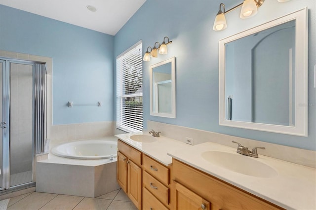 bathroom featuring tile patterned floors, vanity, and plus walk in shower