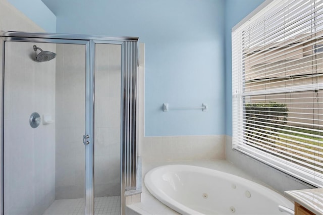 bathroom featuring separate shower and tub and vanity