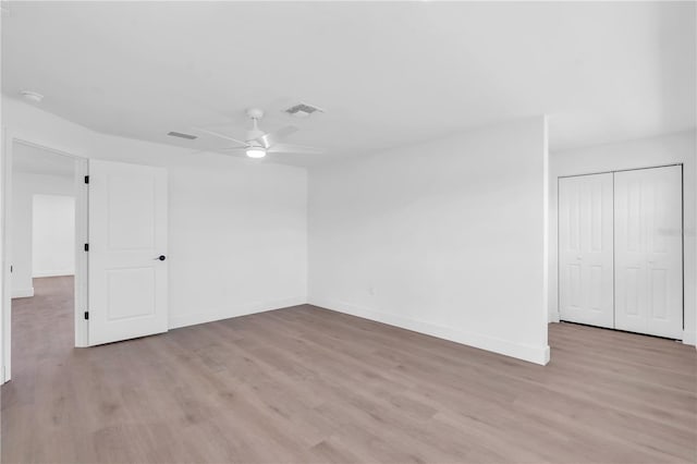1950 Fairview Dr, Englewood, FL 34223 - unfurnished bedroom with light wood-type flooring, a closet, and ceiling fan