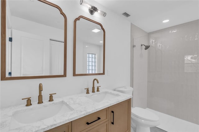 1950 Fairview Dr, Englewood, FL 34223 - bathroom featuring vanity, tiled shower, and toilet