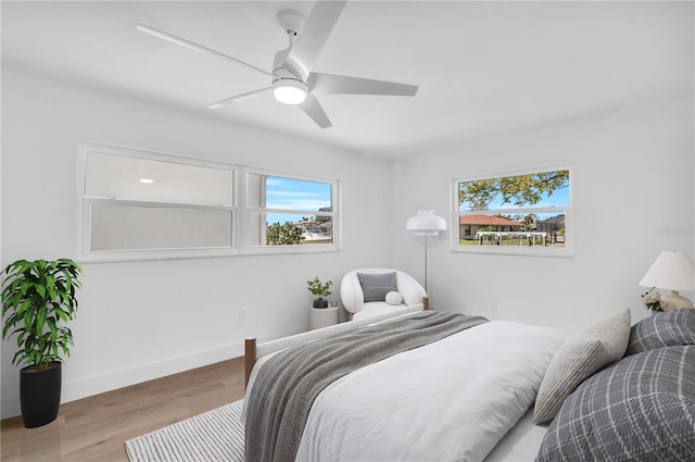 1950 Fairview Dr, Englewood, FL 34223 - bedroom with multiple windows, ceiling fan, and light hardwood / wood-style flooring