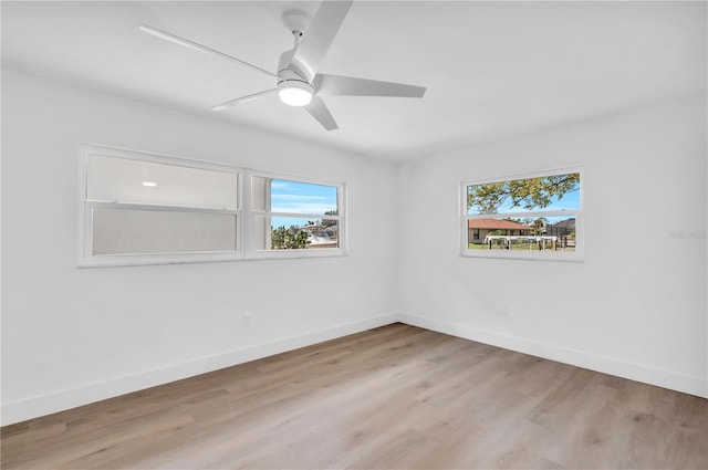 1950 Fairview Dr, Englewood, FL 34223 - unfurnished room featuring ceiling fan, light wood-type flooring, and a healthy amount of sunlight