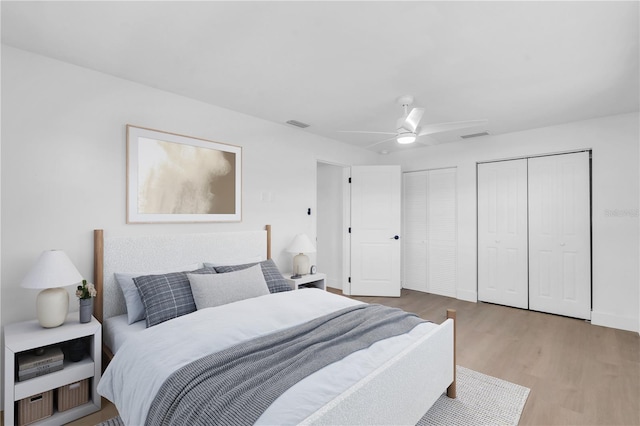 1950 Fairview Dr, Englewood, FL 34223 - bedroom with ceiling fan, two closets, and hardwood / wood-style floors