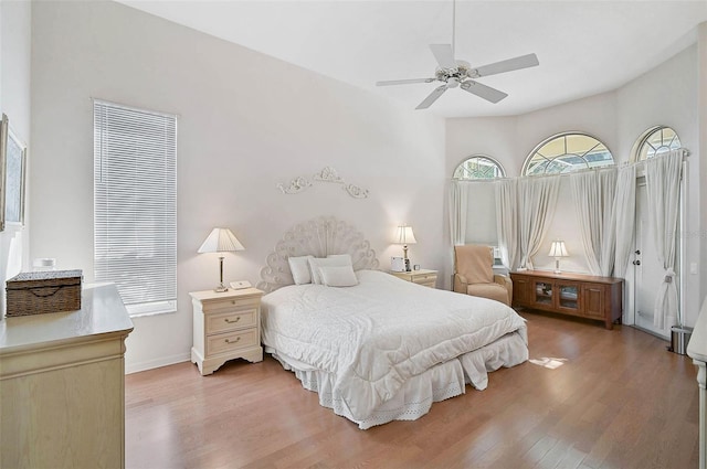 bedroom with hardwood / wood-style flooring and ceiling fan