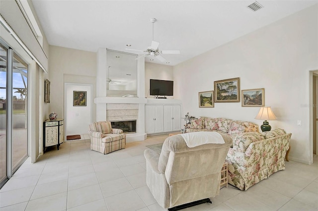 living room with light tile patterned floors and ceiling fan