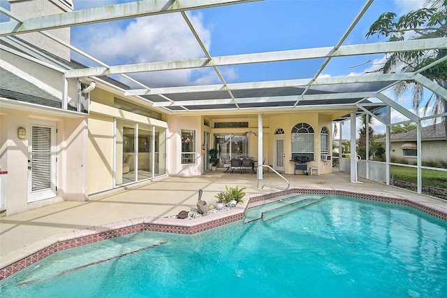 view of swimming pool featuring a patio and glass enclosure