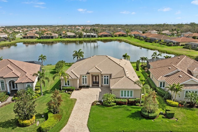 birds eye view of property featuring a residential view and a water view