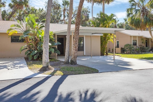 ranch-style house with a carport