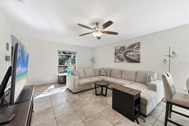 tiled living room with ceiling fan and a textured ceiling