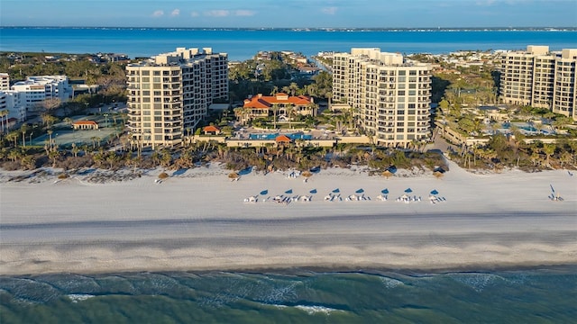 bird's eye view with a water view and a view of the beach