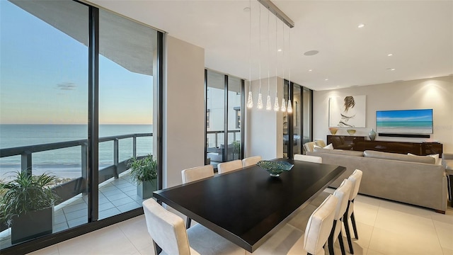 tiled dining space featuring expansive windows and plenty of natural light