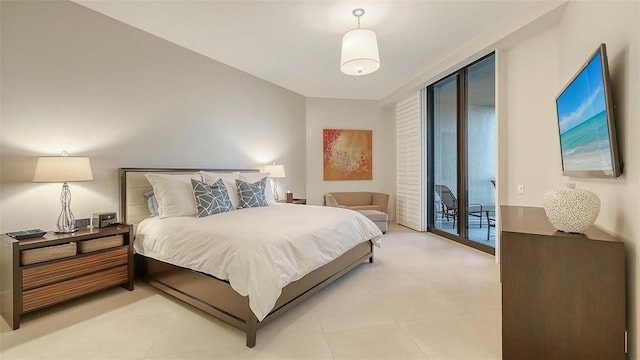 tiled bedroom featuring access to exterior