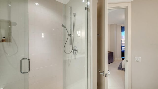 bathroom featuring a shower with shower door