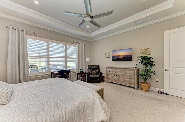 carpeted bedroom featuring crown molding, ceiling fan, and a raised ceiling