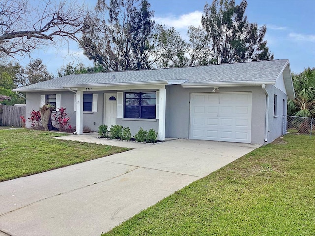 ranch-style home with a garage and a front yard