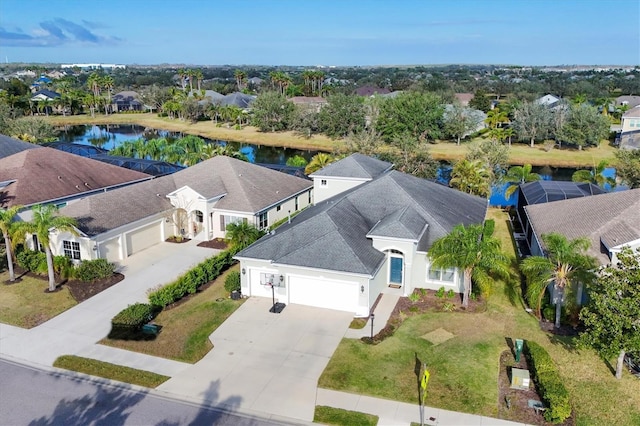 birds eye view of property with a water view