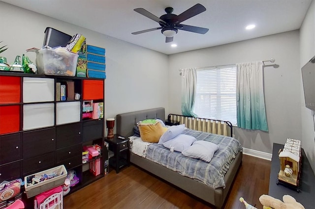 bedroom featuring ceiling fan and dark hardwood / wood-style flooring