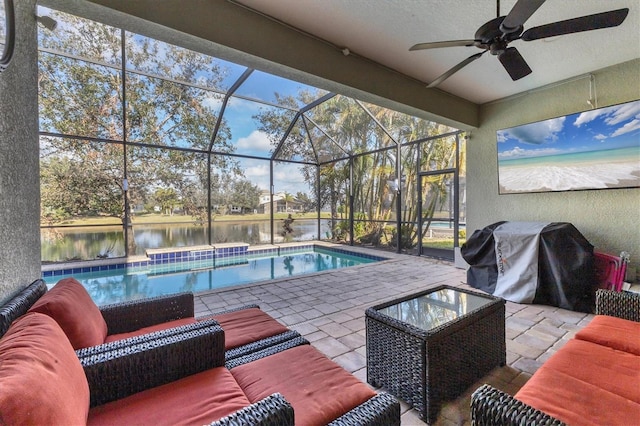 view of pool featuring a lanai, grilling area, outdoor lounge area, and a water view