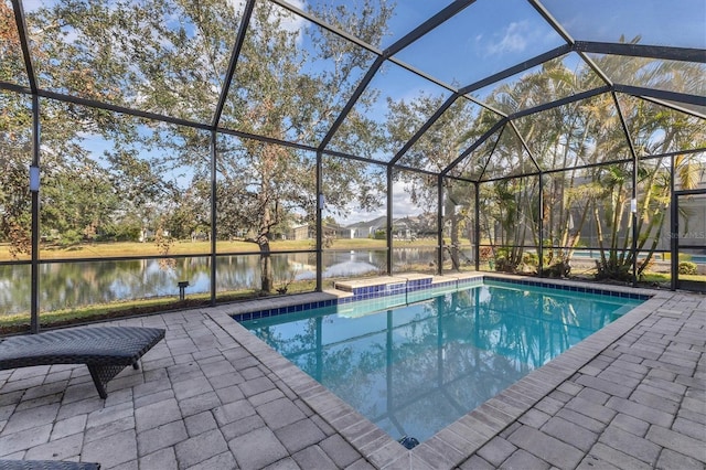 view of swimming pool with a water view, a lanai, and a patio