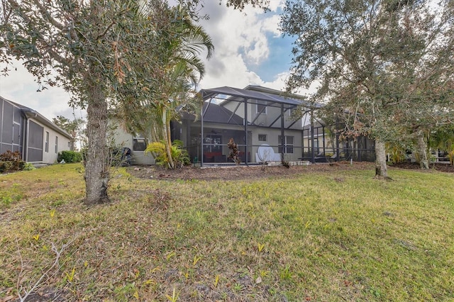 view of yard with glass enclosure