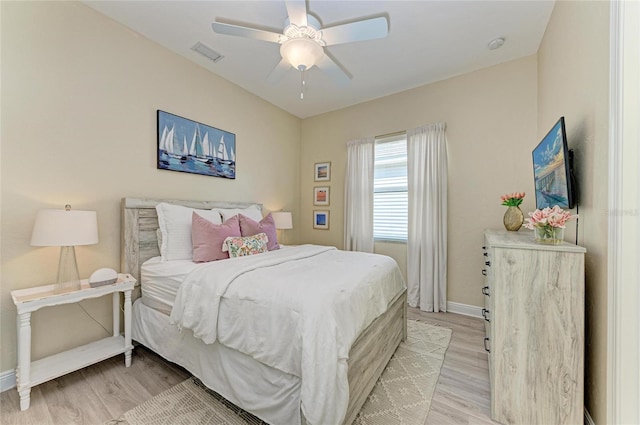 bedroom with light hardwood / wood-style flooring and ceiling fan