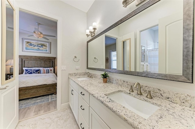 bathroom featuring ceiling fan and vanity