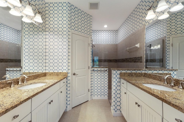 bathroom with vanity, tile patterned floors, and walk in shower