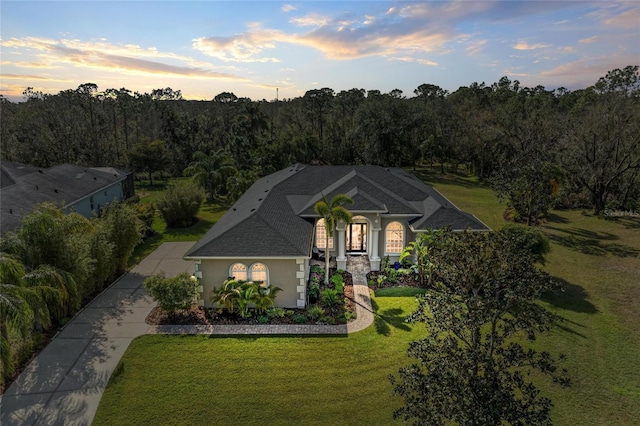 view of front of house with a lawn