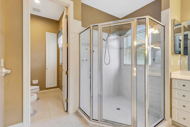 bathroom with a bidet, tile patterned flooring, vanity, toilet, and walk in shower