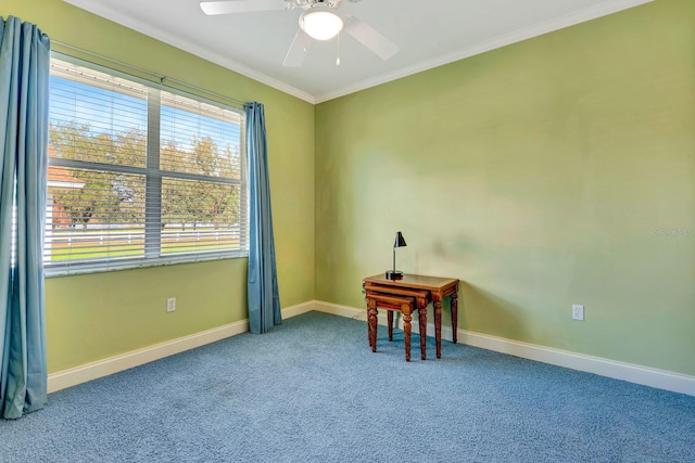 spare room with crown molding, ceiling fan, and carpet flooring