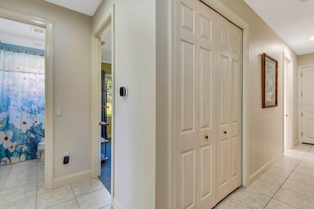 hallway featuring light tile patterned floors