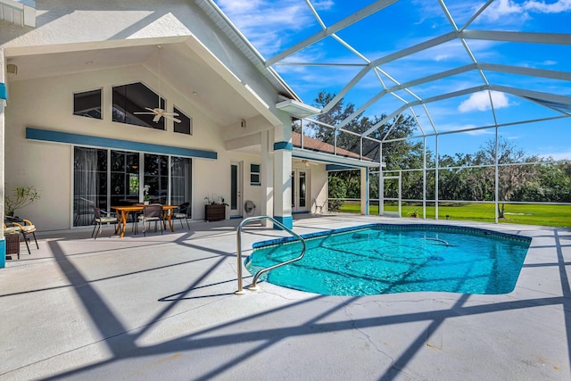 view of pool featuring ceiling fan, a patio, and glass enclosure