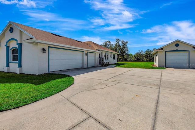 view of property exterior with a garage and a lawn