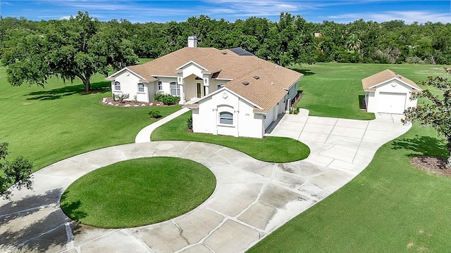 5750 Saddle Oak Trl, Sarasota, FL 34241 - view of front of house with curved driveway, stucco siding, and a front yard