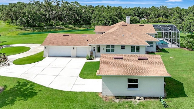 5750 Saddle Oak Trl, Sarasota, FL 34241 - view of front of property featuring concrete driveway, a garage, stucco siding, a front lawn, and a shingled roof