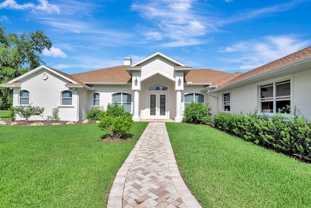 5750 Saddle Oak Trl, Sarasota, FL 34241 - mediterranean / spanish home featuring french doors, stucco siding, and a front yard