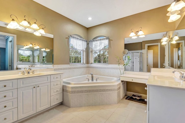 5750 Saddle Oak Trl, Sarasota, FL 34241 - full bathroom featuring a garden tub, tile patterned floors, two vanities, and a stall shower