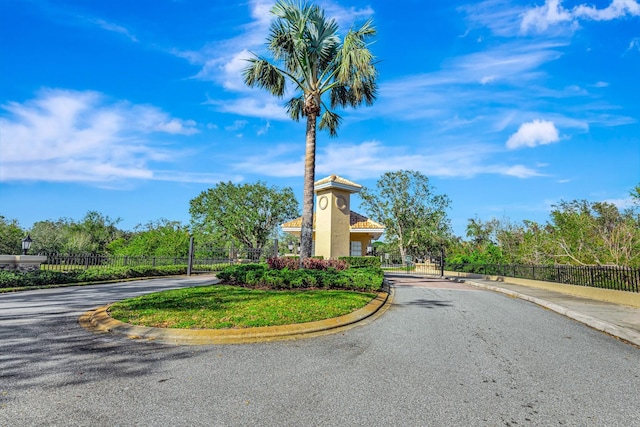 5750 Saddle Oak Trl, Sarasota, FL 34241 - view of asphalt road with curbs and a gated entry