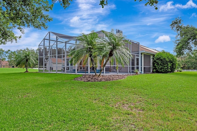 5750 Saddle Oak Trl, Sarasota, FL 34241 - rear view of house featuring a yard, a chimney, and a pool