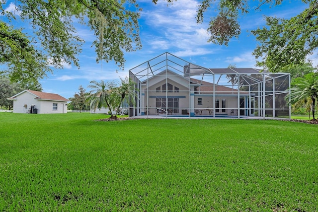 5750 Saddle Oak Trl, Sarasota, FL 34241 - rear view of house with a yard and glass enclosure