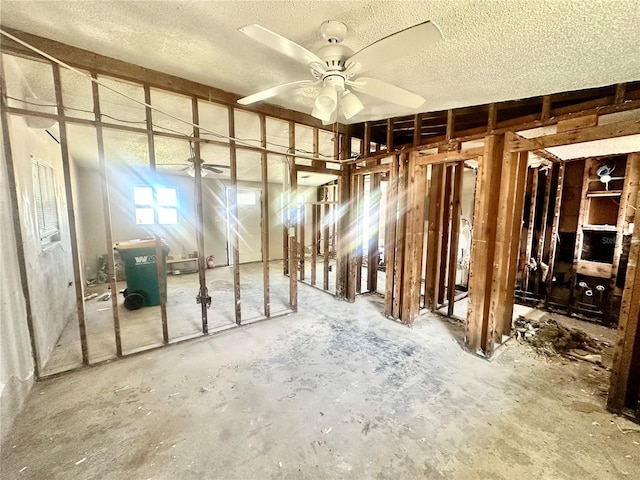 misc room with a textured ceiling and ceiling fan