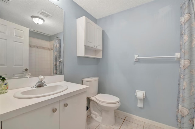 bathroom with visible vents, toilet, a textured ceiling, tile patterned flooring, and baseboards