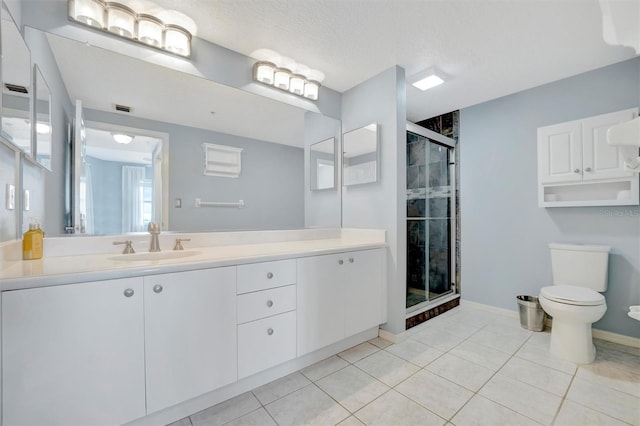 full bathroom featuring toilet, a stall shower, a textured ceiling, and tile patterned floors