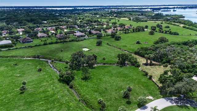 bird's eye view with a water view and a rural view