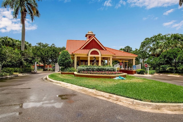 view of home's community with a lawn